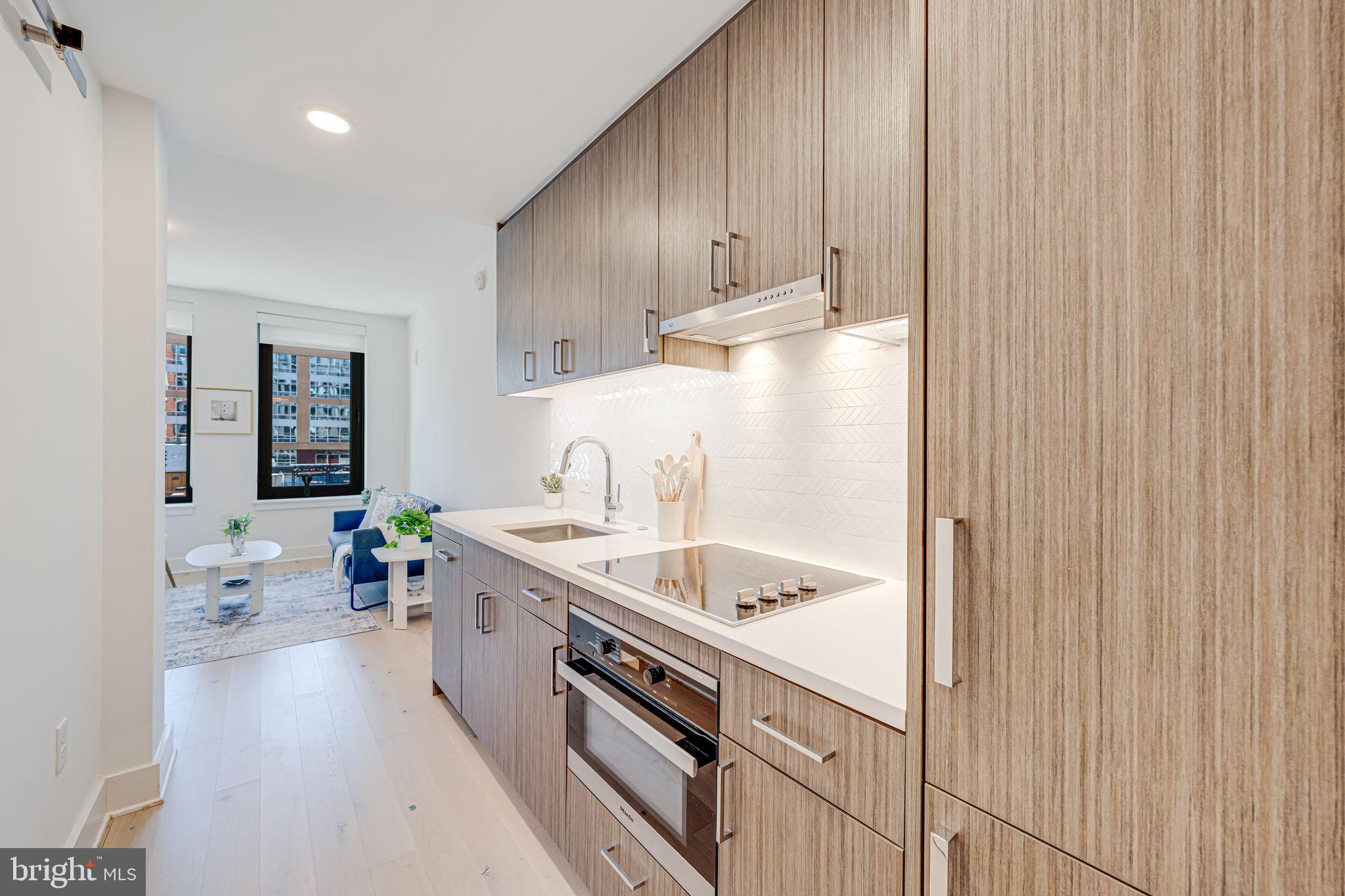 1211 Van Street Southeast, Unit 309 Washington, DC 20003 - Photo 17 of 66 a kitchen with a sink and cabinets