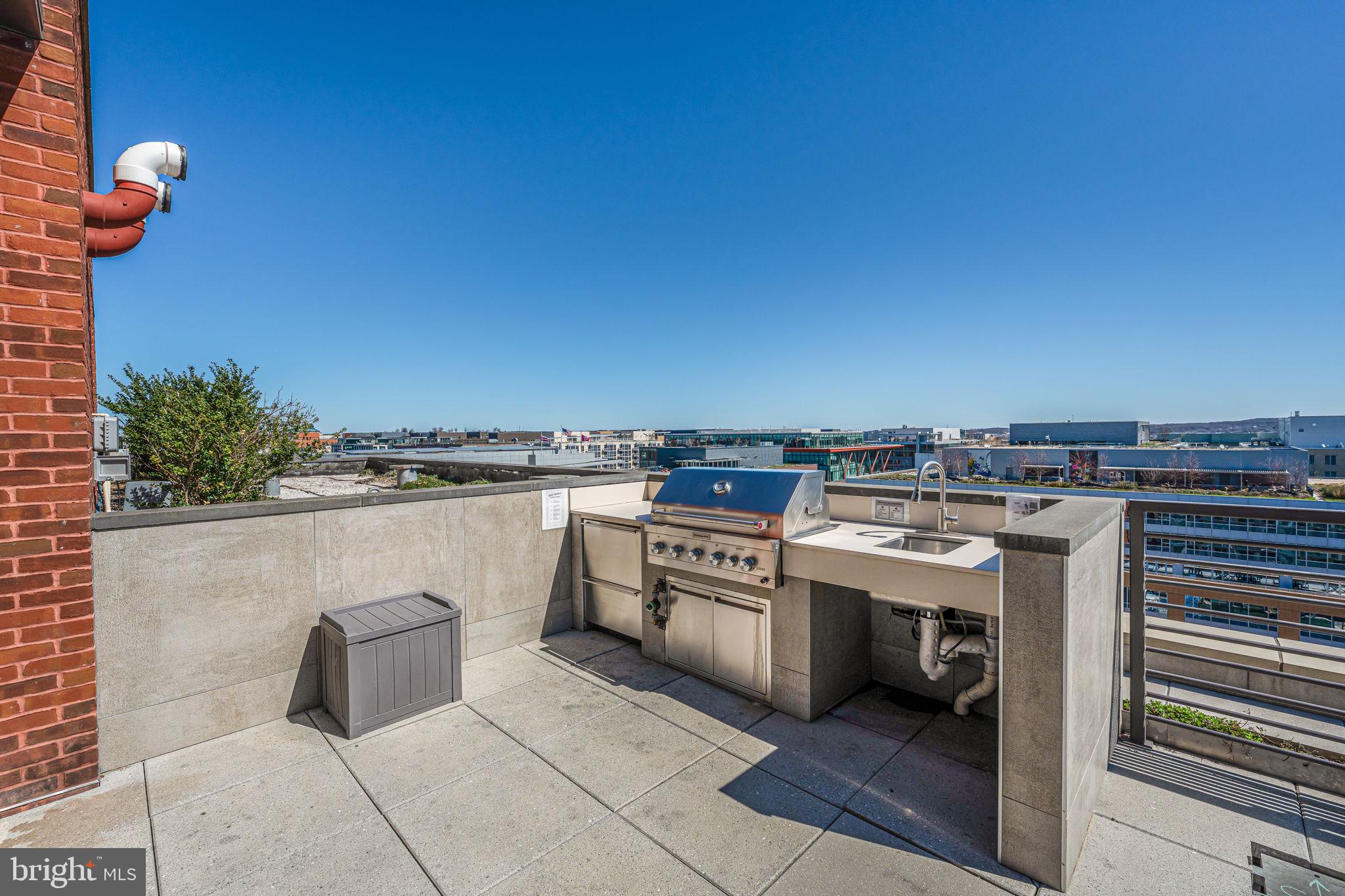 1211 Van Street Southeast, Unit 309 Washington, DC 20003 - Photo 43 of 66 a kitchen with a stove and a microwave