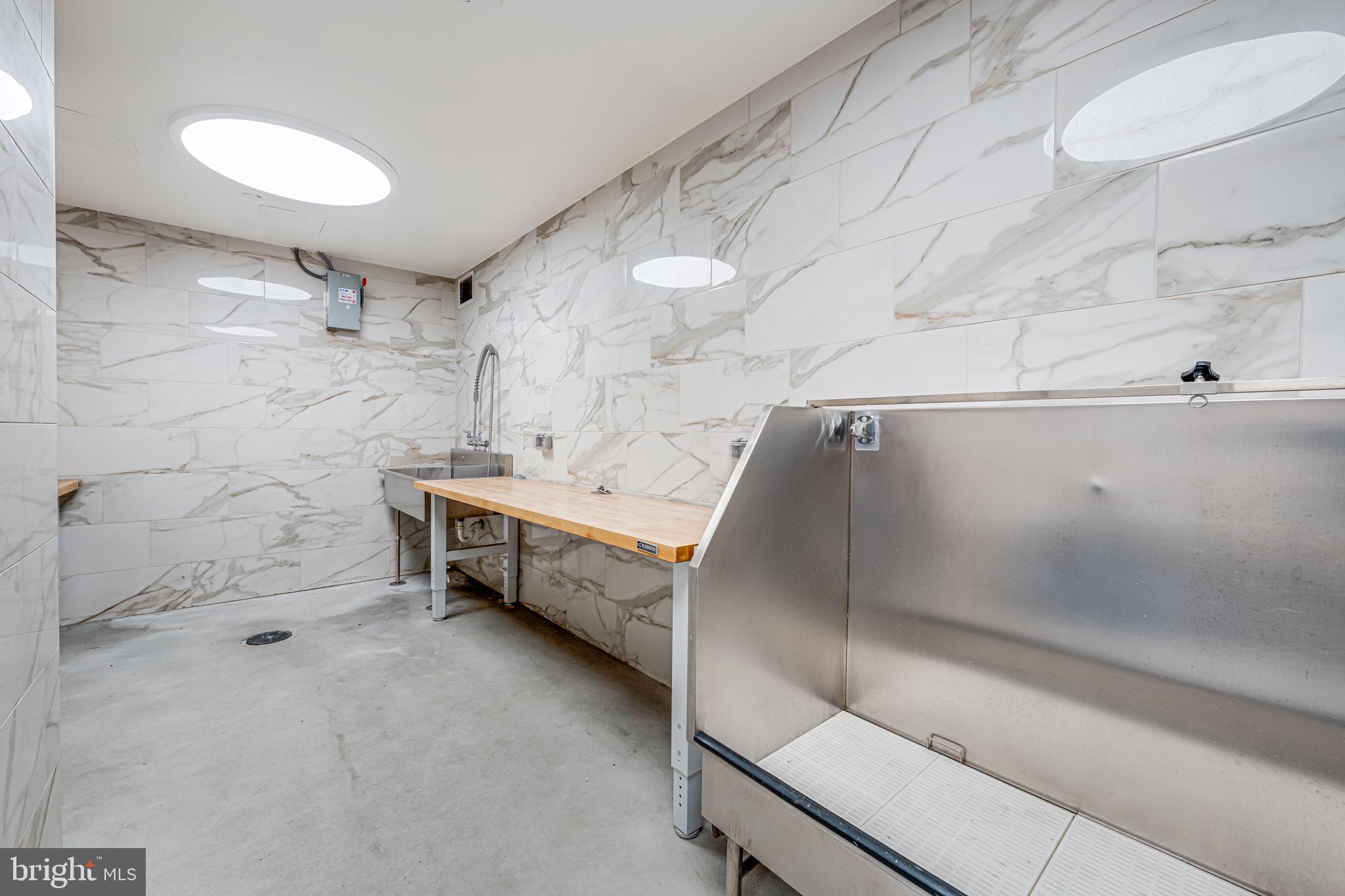 1211 Van Street Southeast, Unit 309 Washington, DC 20003 - Photo 47 of 66 a bathroom with a tub and a shower