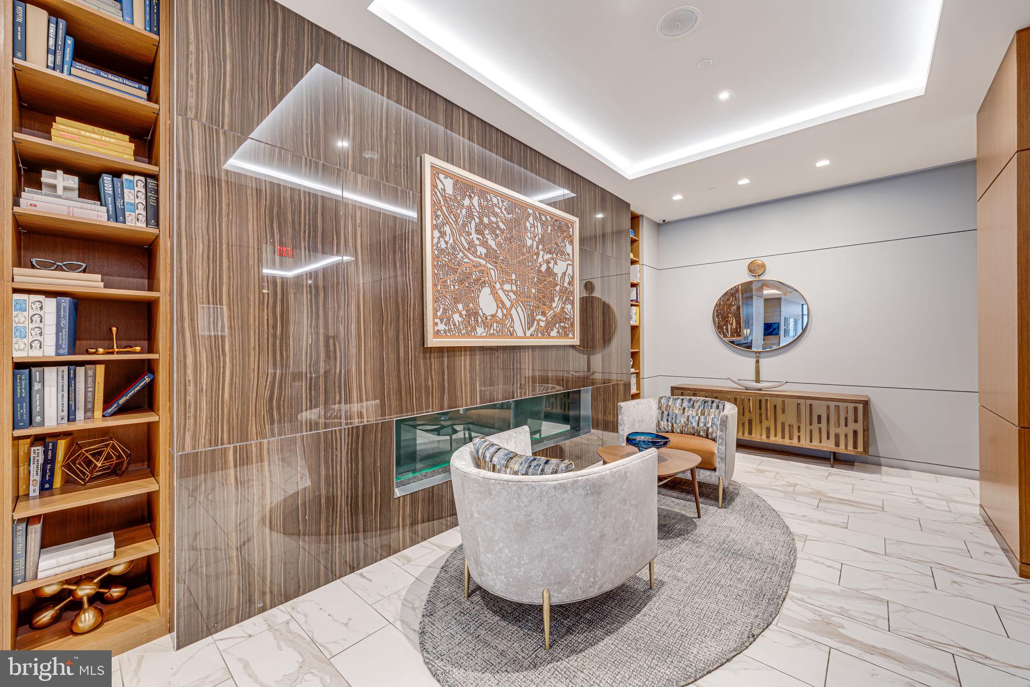 1211 Van Street Southeast, Unit 309 Washington, DC 20003 - Photo 5 of 66 a living room with furniture and a book shelf