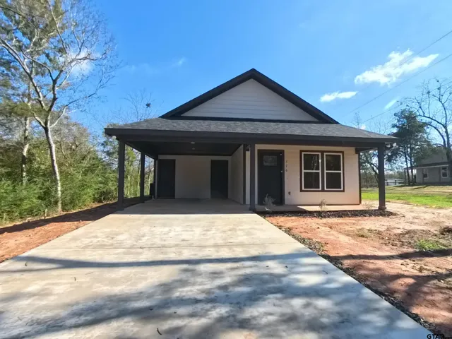 a house with yard in front of it