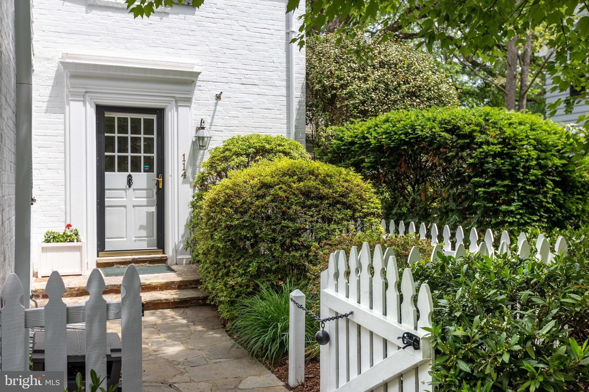 114 Bellemore Road Baltimore, MD 21210 - Photo 3 of 49 a front view of a house with a garden
