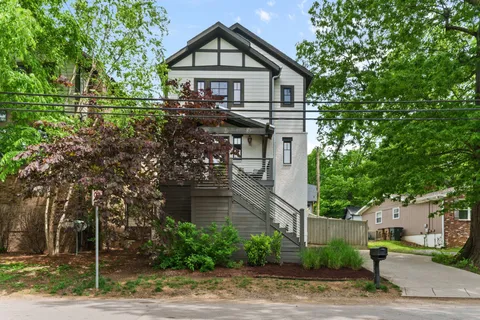 a view of a house with a yard and plants
