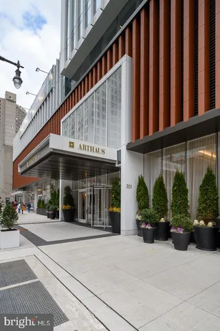 a living room with a couch and a chandelier