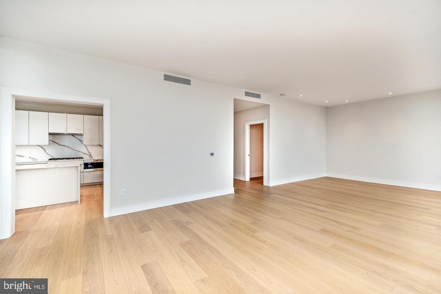 301 South Broad Street, Unit 4001 Philadelphia, PA 19107 - Photo 11 of 84 a view of empty room with kitchen and sink
