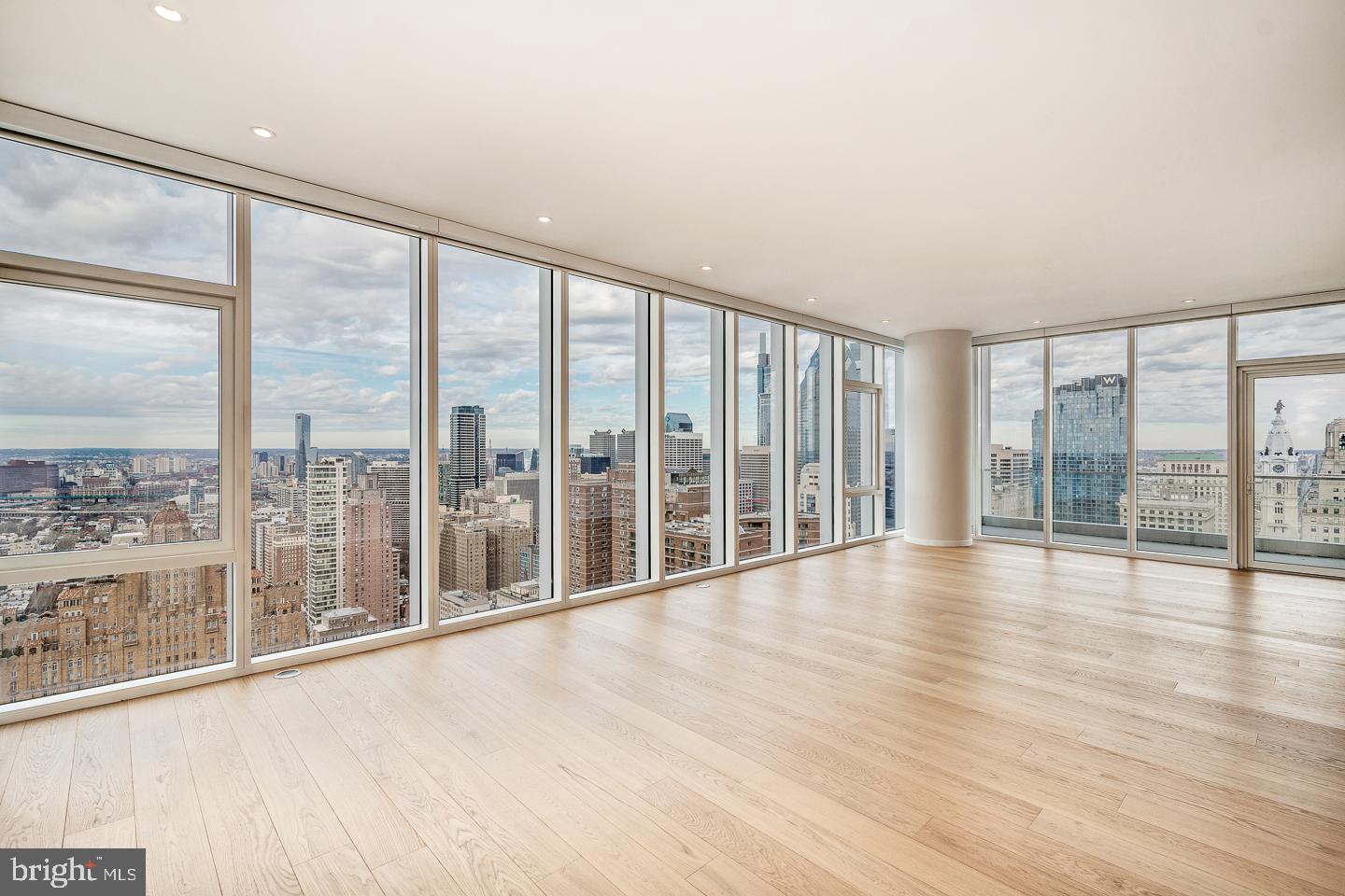 301 South Broad Street, Unit 4001 Philadelphia, PA 19107 - Photo 12 of 84 a view of an empty room with wooden floor and a window