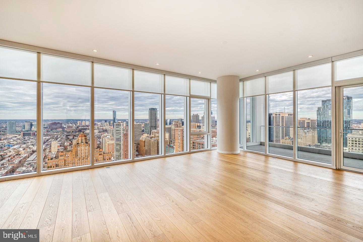 301 South Broad Street, Unit 4001 Philadelphia, PA 19107 - Photo 13 of 84 a view of an empty room with wooden floor and a window