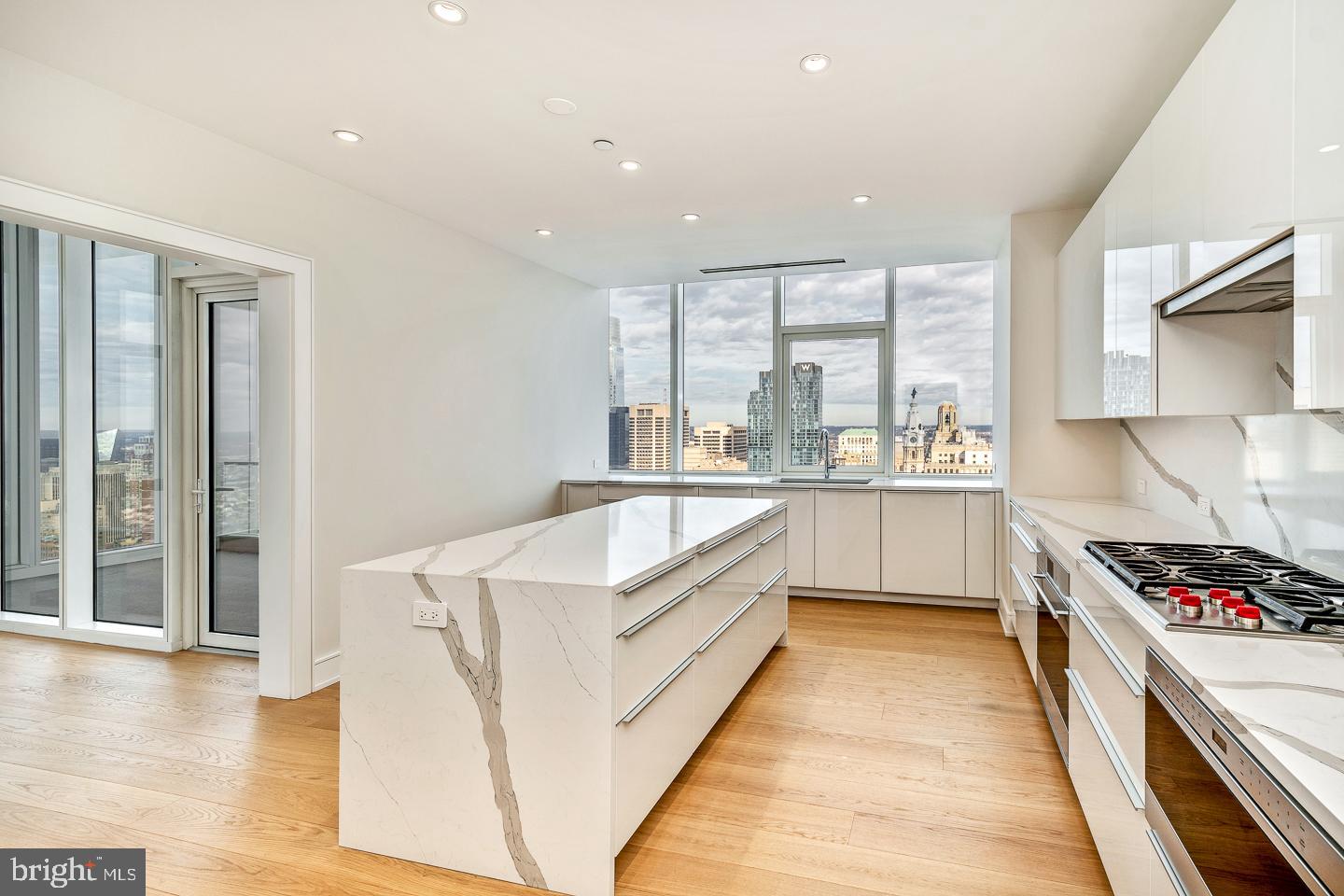 301 South Broad Street, Unit 4001 Philadelphia, PA 19107 - Photo 22 of 84 a large kitchen with stainless steel appliances granite countertop a lot of counter space and wooden floors