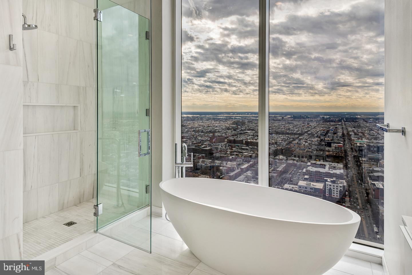 301 South Broad Street, Unit 4001 Philadelphia, PA 19107 - Photo 38 of 84 a white bath tub sitting next to a shower