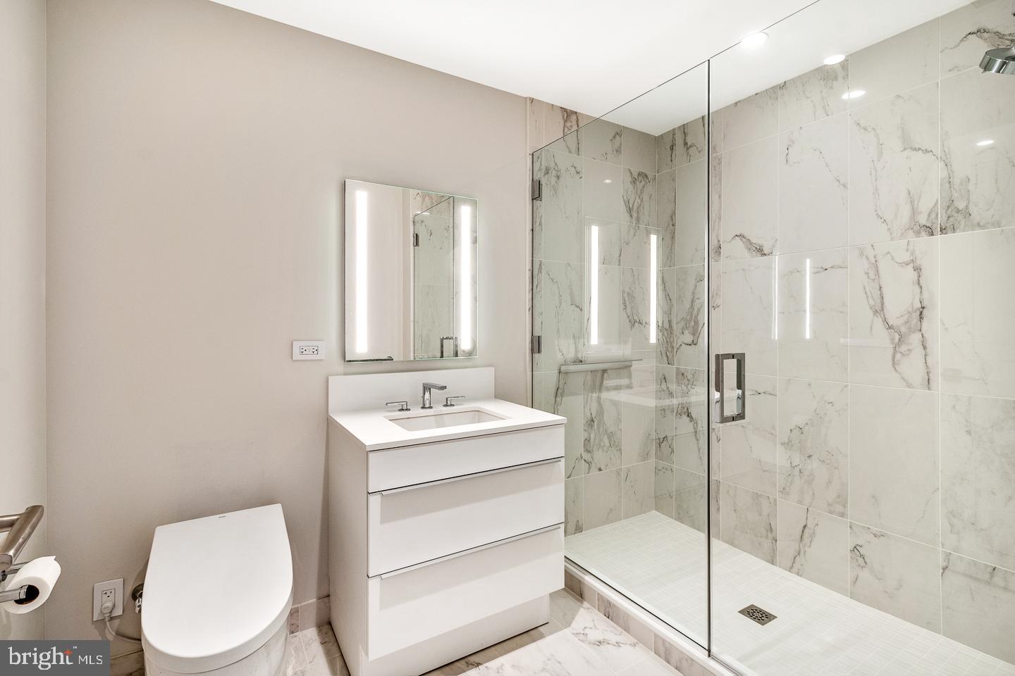 301 South Broad Street, Unit 4001 Philadelphia, PA 19107 - Photo 42 of 84 a bathroom with a toilet a sink and shower