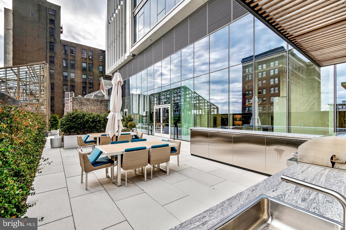 301 South Broad Street, Unit 4001 Philadelphia, PA 19107 - Photo 60 of 84 a view of a patio with couches table and chairs and potted plants