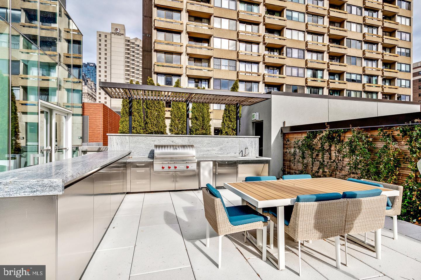301 South Broad Street, Unit 4001 Philadelphia, PA 19107 - Photo 61 of 84 a view of a building with a table and chairs and couches
