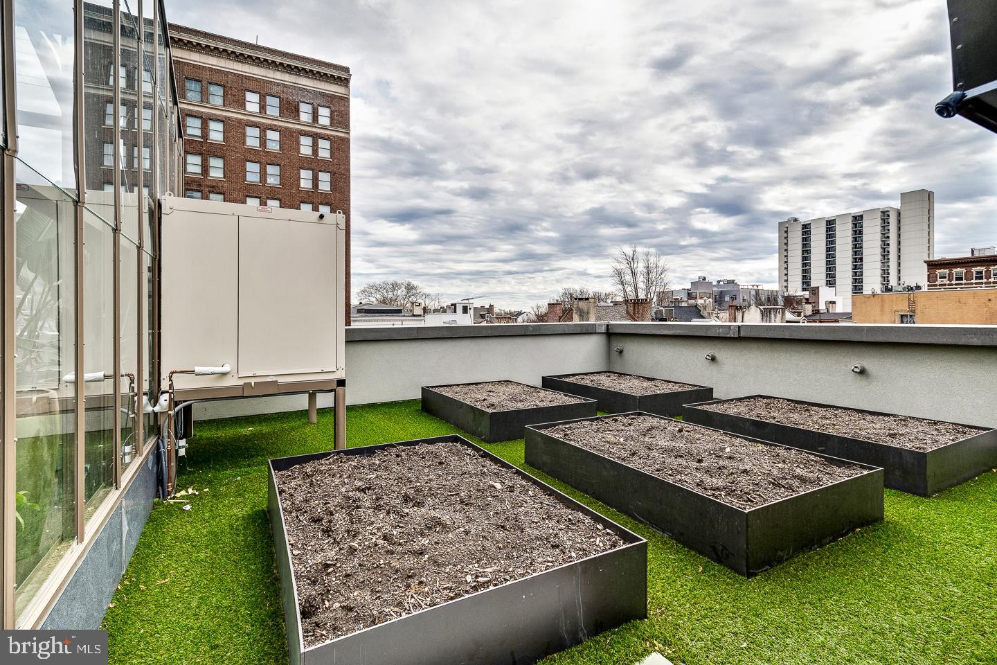 301 South Broad Street, Unit 4001 Philadelphia, PA 19107 - Photo 65 of 84 a view of a kitchen with a sink and a table and chairs