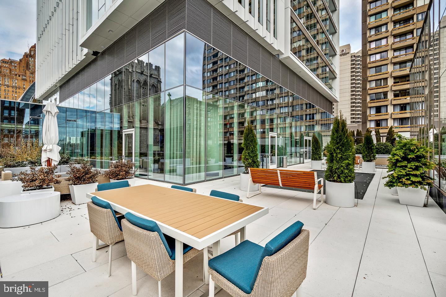301 South Broad Street, Unit 4001 Philadelphia, PA 19107 - Photo 66 of 84 a view of a patio with couches table and chairs and potted plants