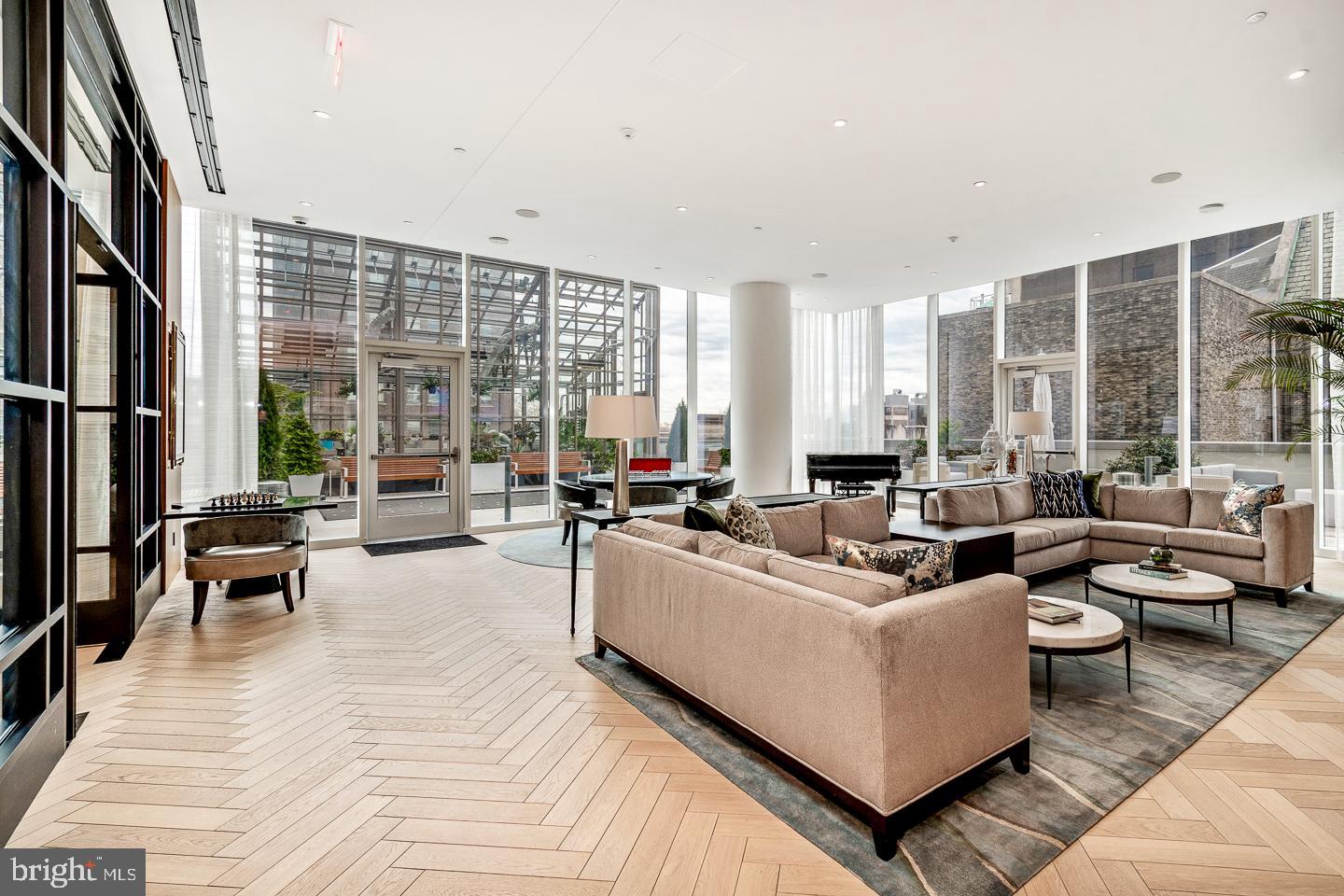 301 South Broad Street, Unit 4001 Philadelphia, PA 19107 - Photo 72 of 84 a living room with furniture and large windows