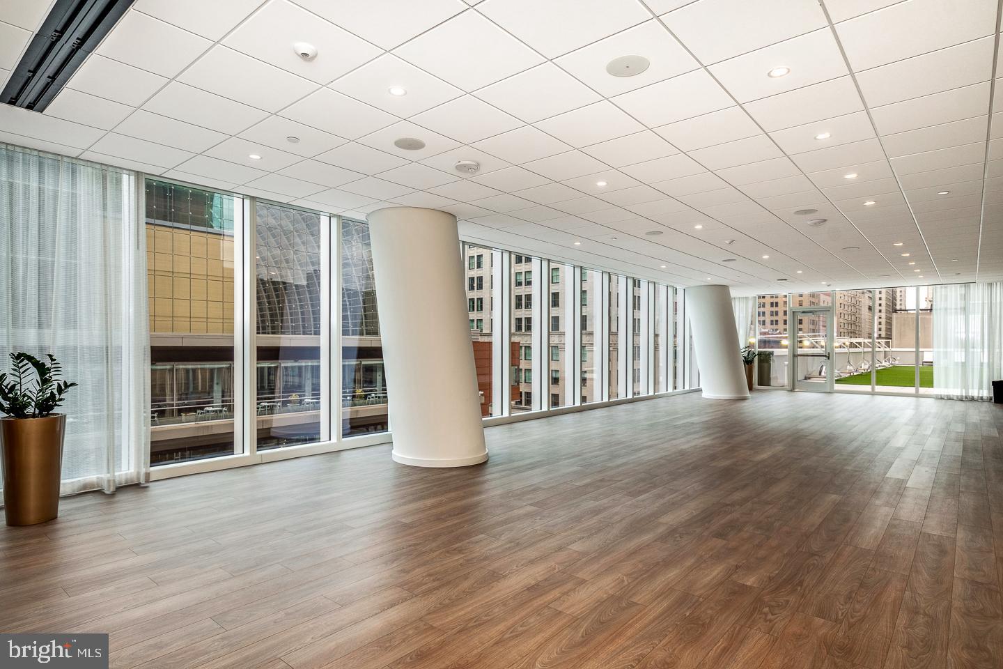 301 South Broad Street, Unit 4001 Philadelphia, PA 19107 - Photo 80 of 84 a view of an empty room with wooden floor and a window