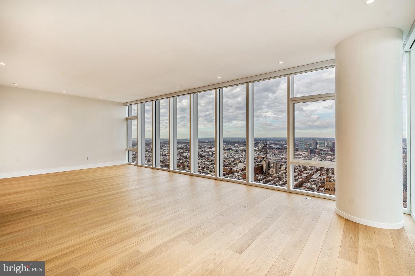 301 South Broad Street, Unit 4001 Philadelphia, PA 19107 - Photo 8 of 84 a view of an empty room with wooden floor and a window