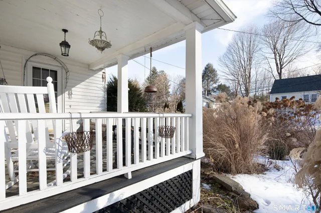 a view of balcony with wooden floor