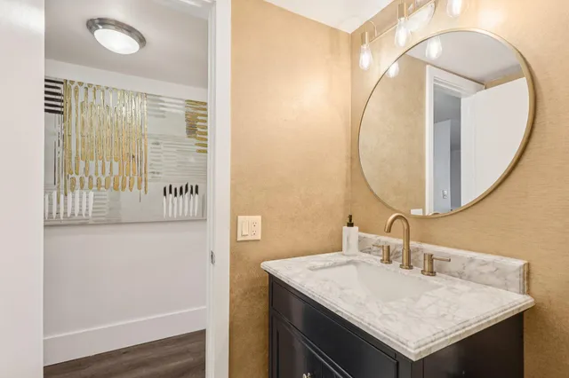 a bathroom with a sink and a mirror