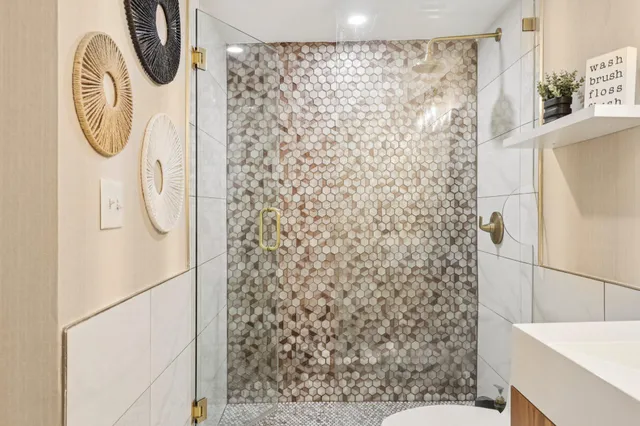 a bathroom with a shower curtain and a sink