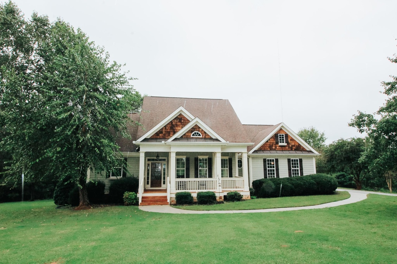 100 Sidney Pope Road Newnan, GA 30263 - Photo 1 of 1 a front view of a house with a yard