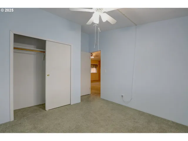 a view of an empty room with a bathroom