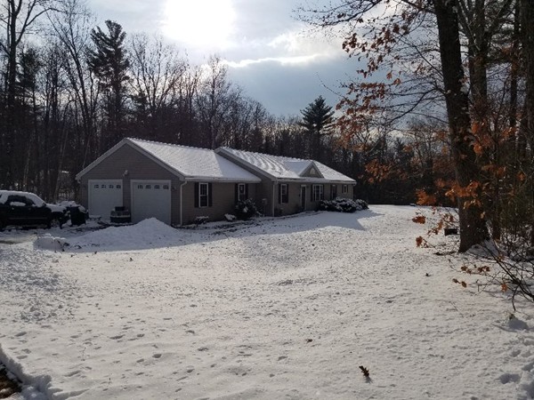 91 Meadow Road Townsend, MA 01469 - Photo 9 of 9 a front view of a house with a yard covered with snow