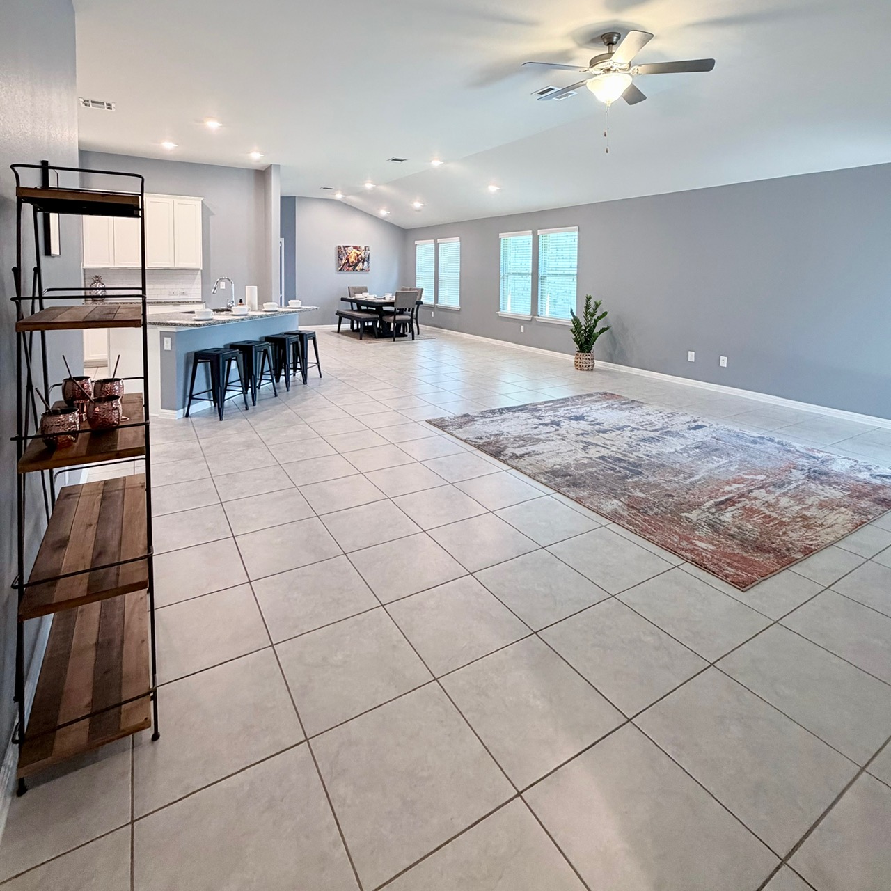 1005 Sundrops Street Leander, TX 78641 - Photo 14 of 39 a large kitchen with stainless steel appliances granite countertop a stove a sink and a refrigerator
