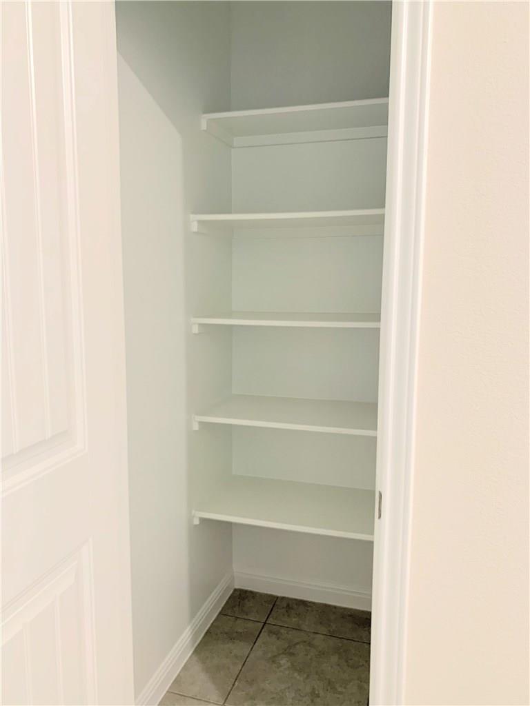 1005 Sundrops Street Leander, TX 78641 - Photo 18 of 39 a view of an empty walk in closet