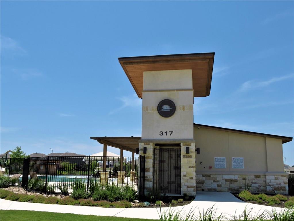 1005 Sundrops Street Leander, TX 78641 - Photo 29 of 39 a front view of a house with garden