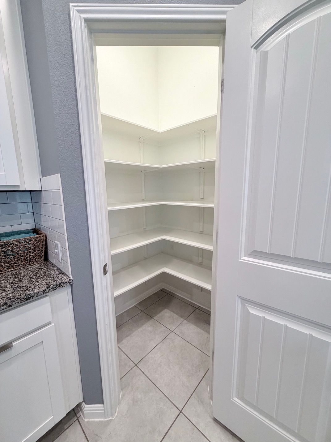1005 Sundrops Street Leander, TX 78641 - Photo 7 of 39 a bathroom with a granite countertop sink and a vanity
