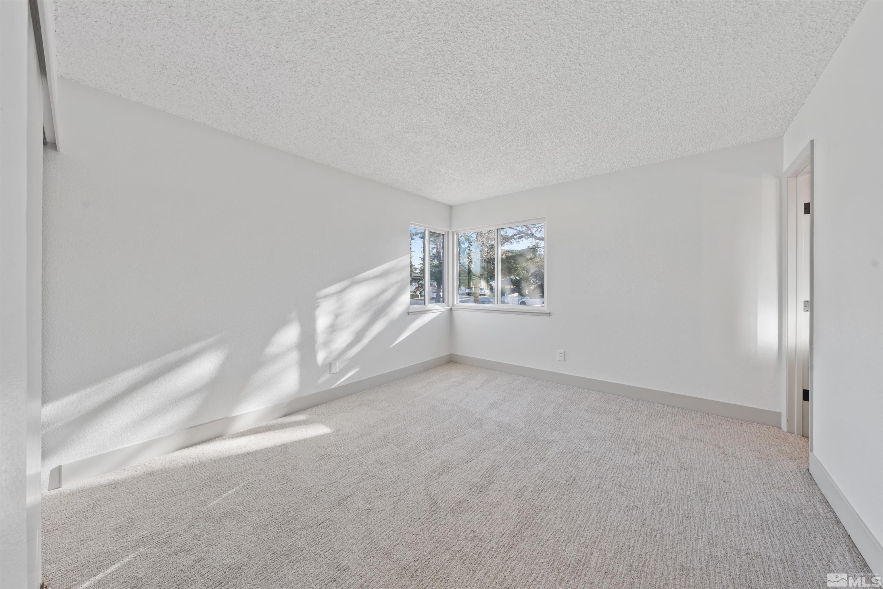 7750 Yorkshire Drive Reno, NV 89506 - Photo 13 of 33 a view of an empty room with a window