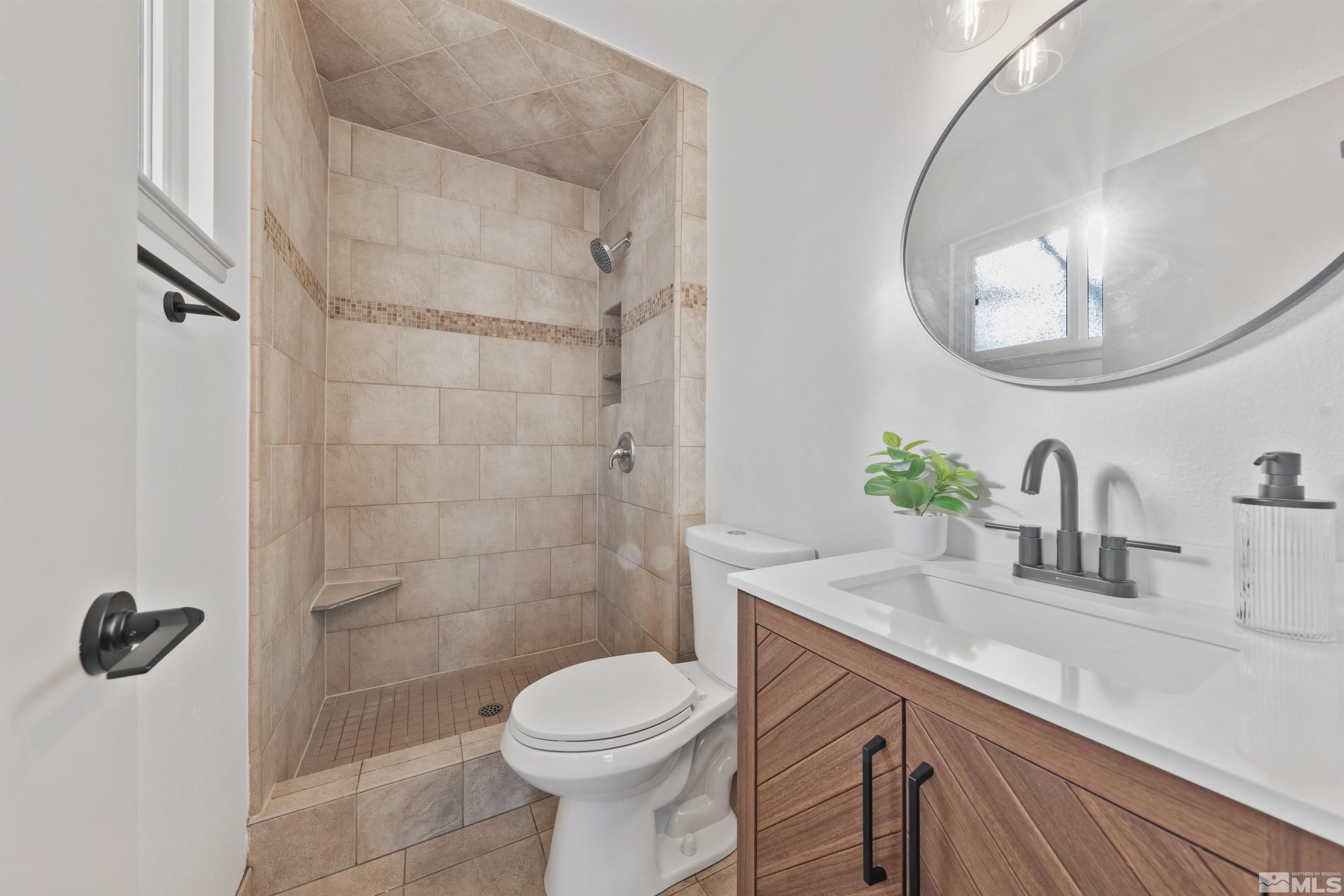 7750 Yorkshire Drive Reno, NV 89506 - Photo 15 of 33 a bathroom with a sink a toilet and shower