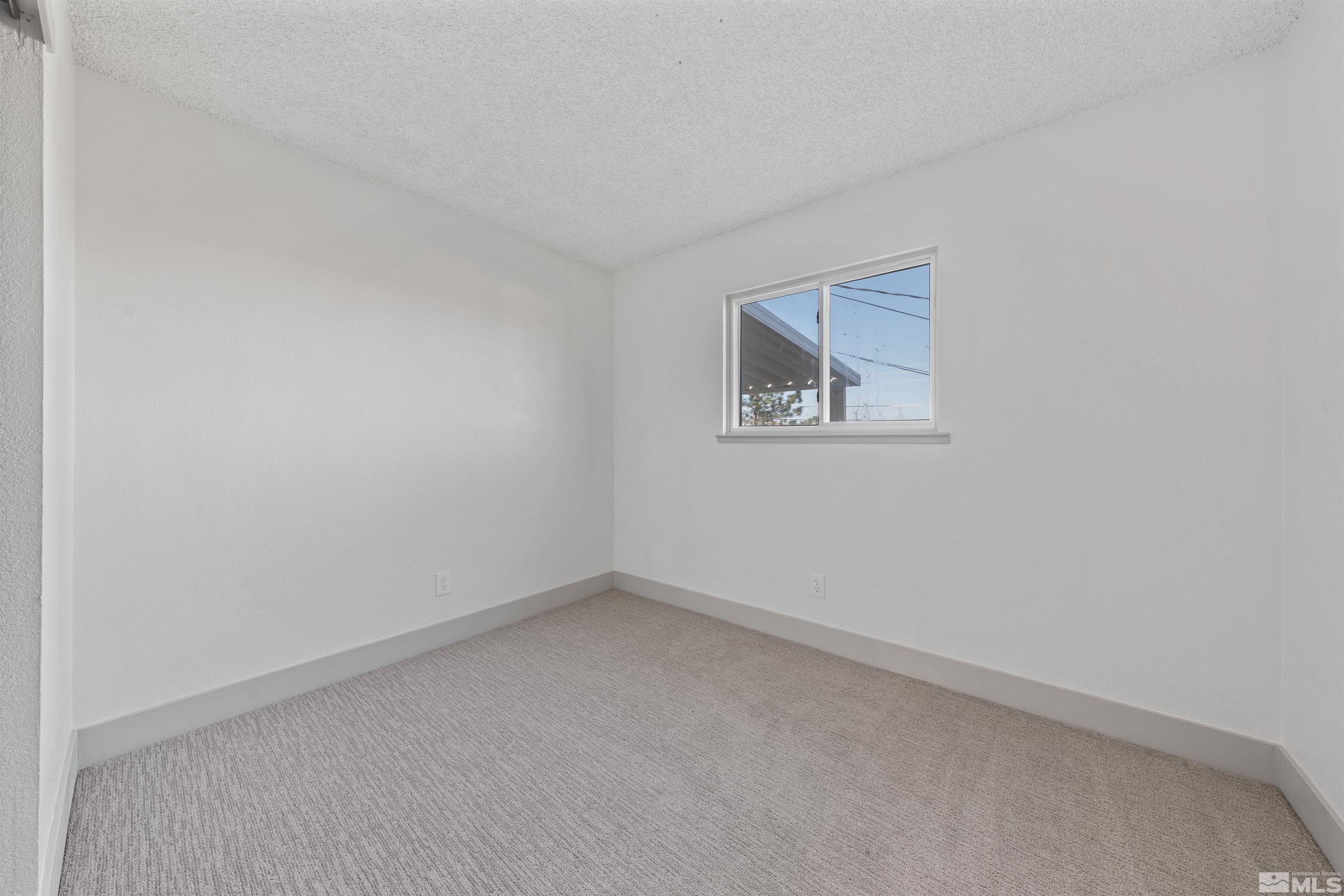 7750 Yorkshire Drive Reno, NV 89506 - Photo 16 of 33 an empty room with a window