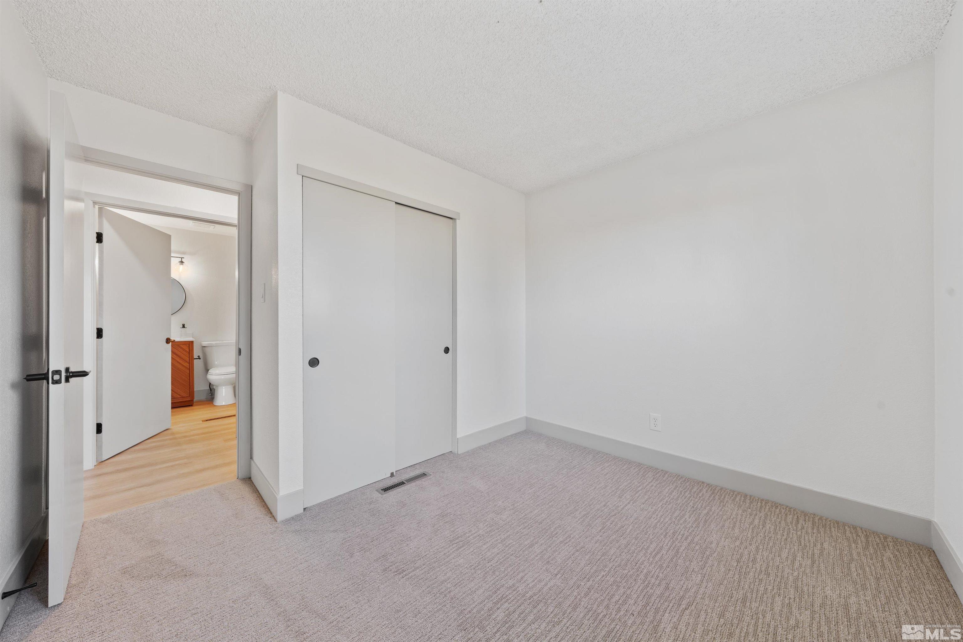 7750 Yorkshire Drive Reno, NV 89506 - Photo 19 of 33 wooden floor and cabinet in an empty room