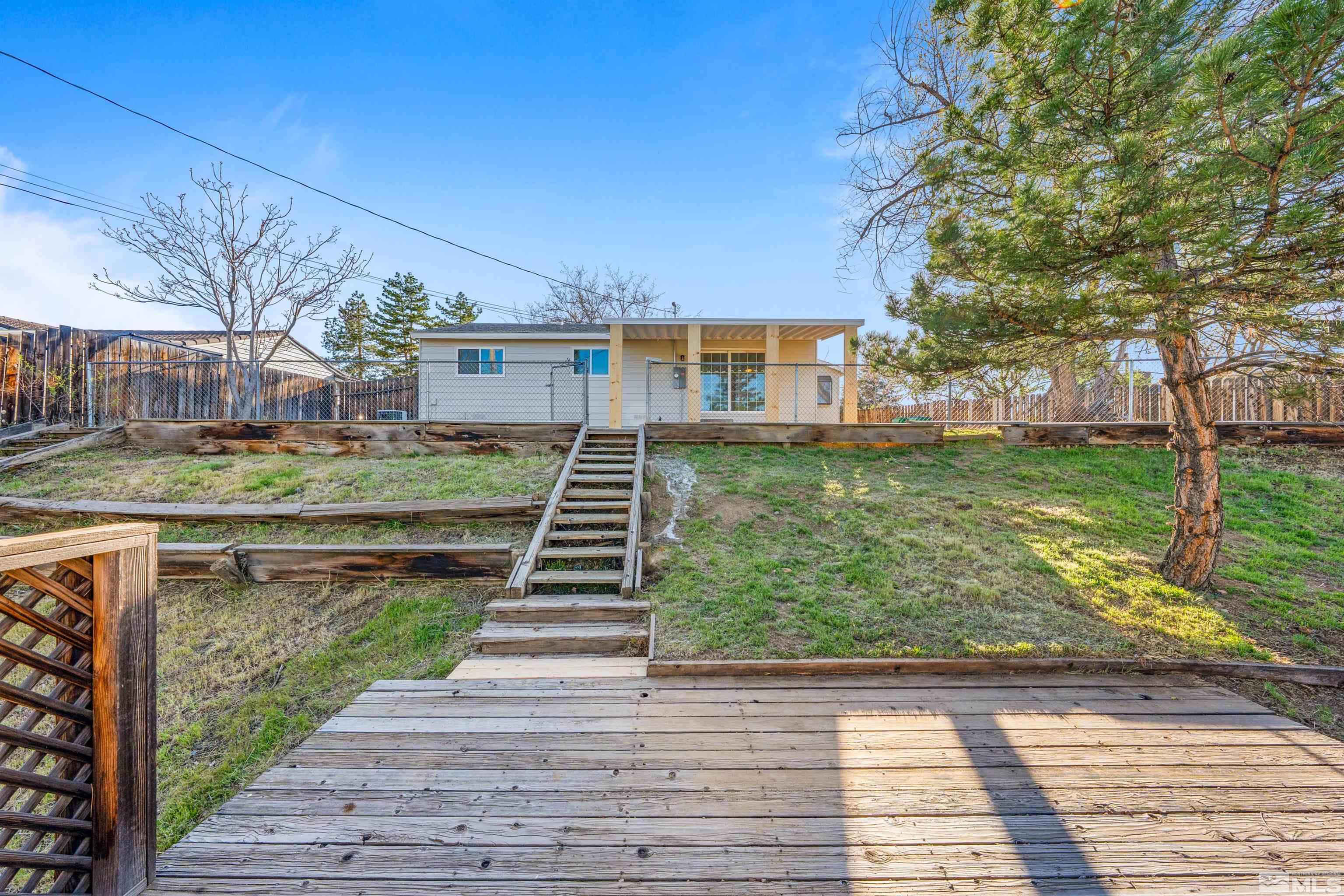 7750 Yorkshire Drive Reno, NV 89506 - Photo 22 of 33 a view of a house with backyard and trees