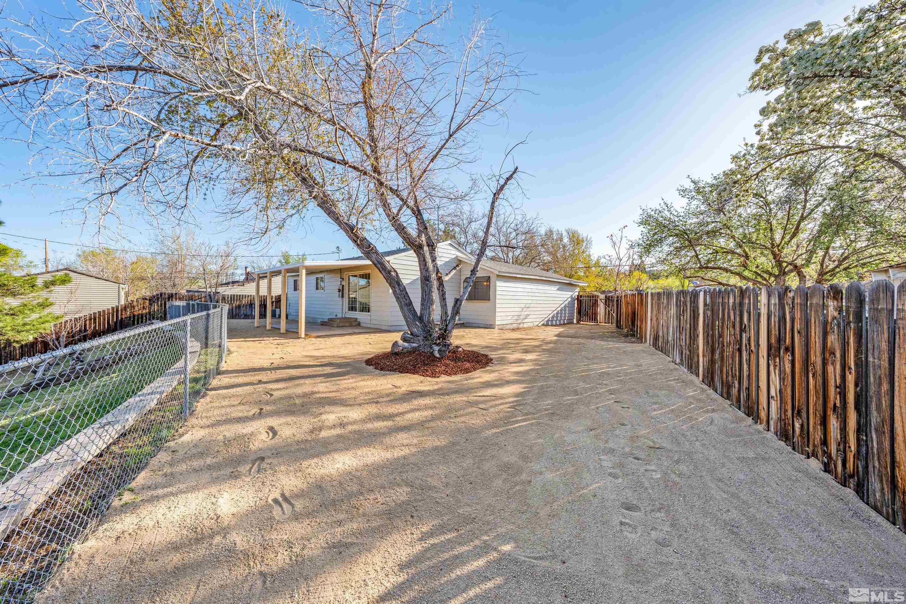 7750 Yorkshire Drive Reno, NV 89506 - Photo 24 of 33 a view of street with large trees