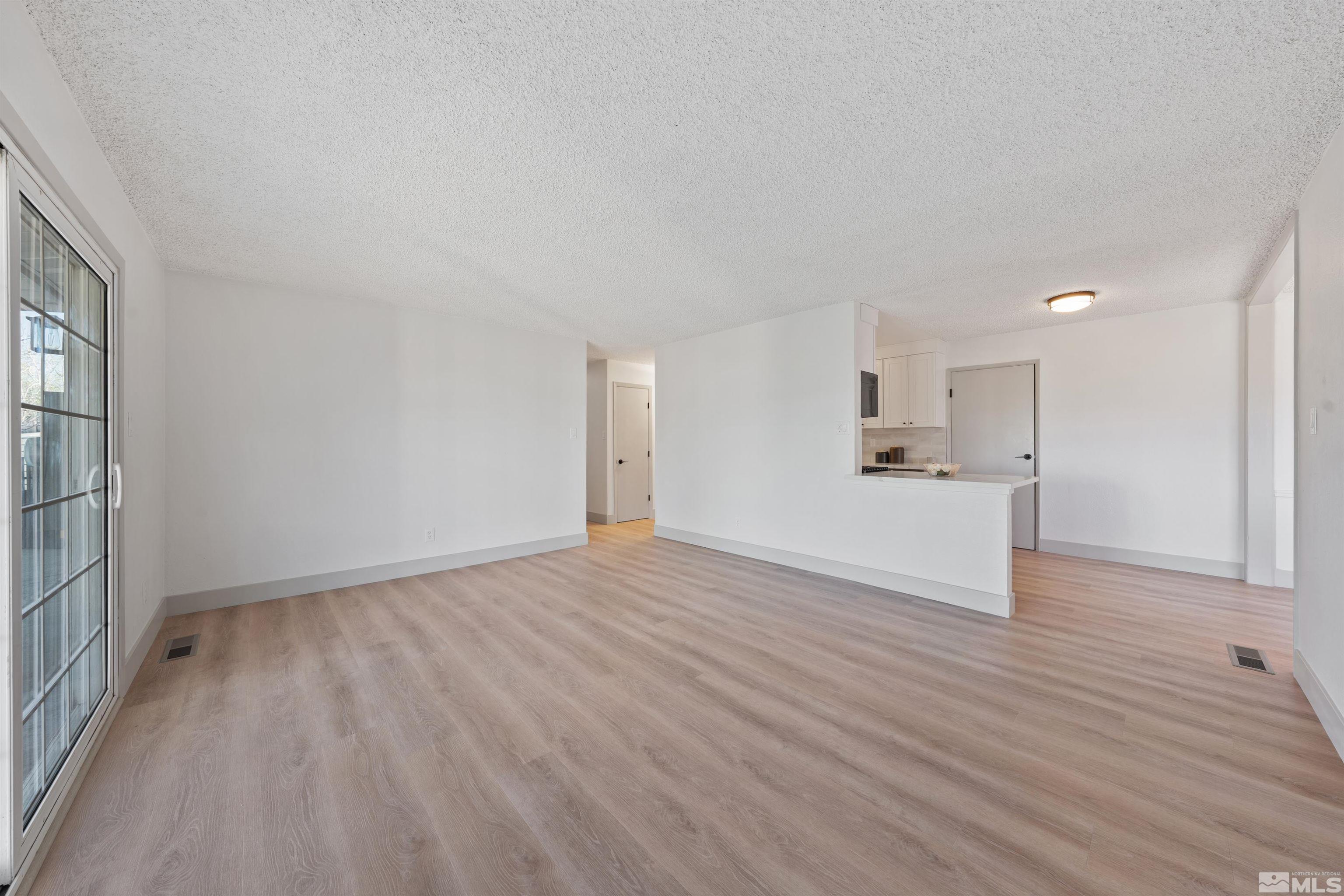 7750 Yorkshire Drive Reno, NV 89506 - Photo 10 of 33 a view of empty room with wooden floor