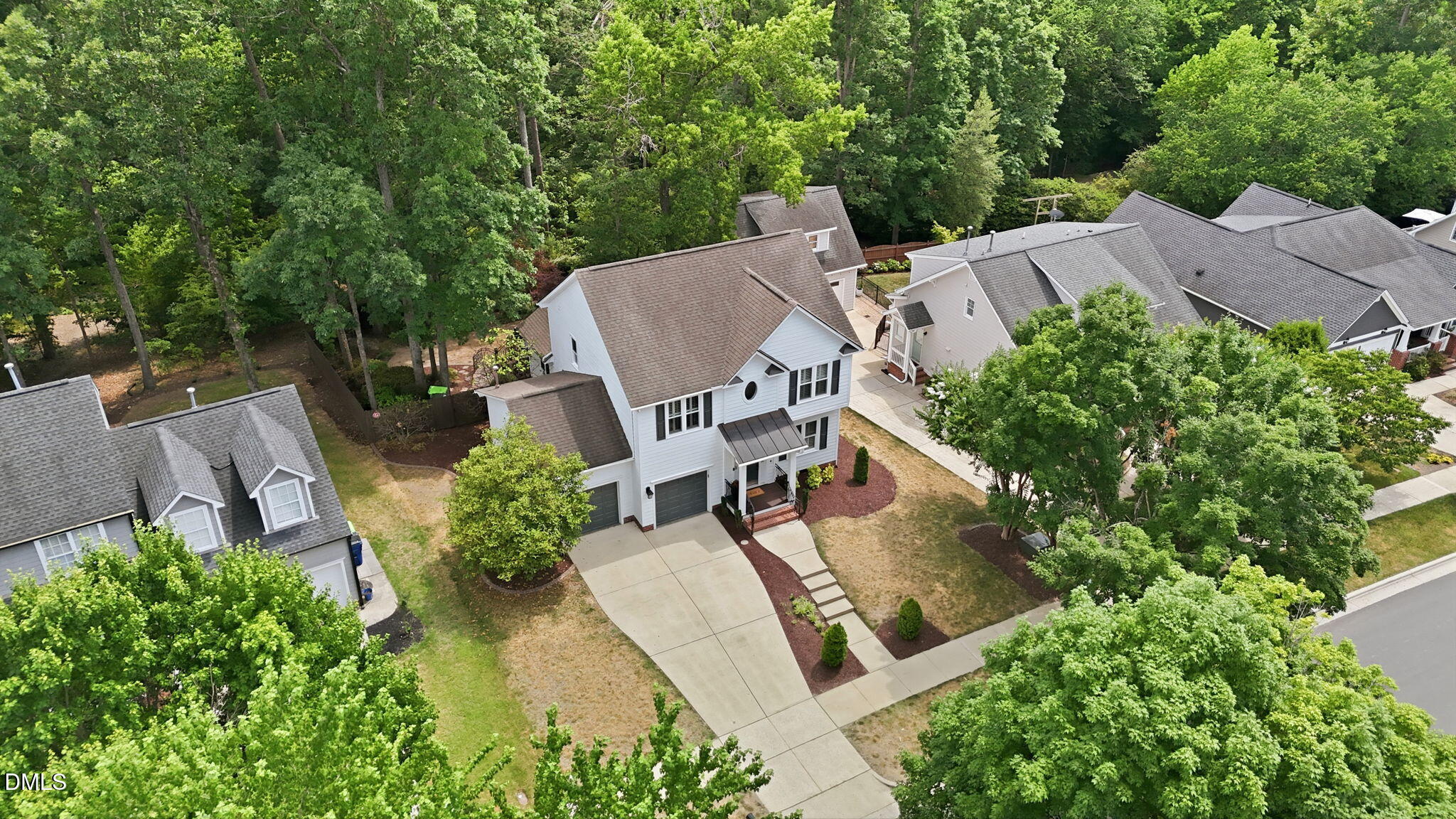 1716 Farmington Grove Drive Raleigh, NC 27614 - Photo 7 of 41 an aerial view of a house with outdoor space and trees all around