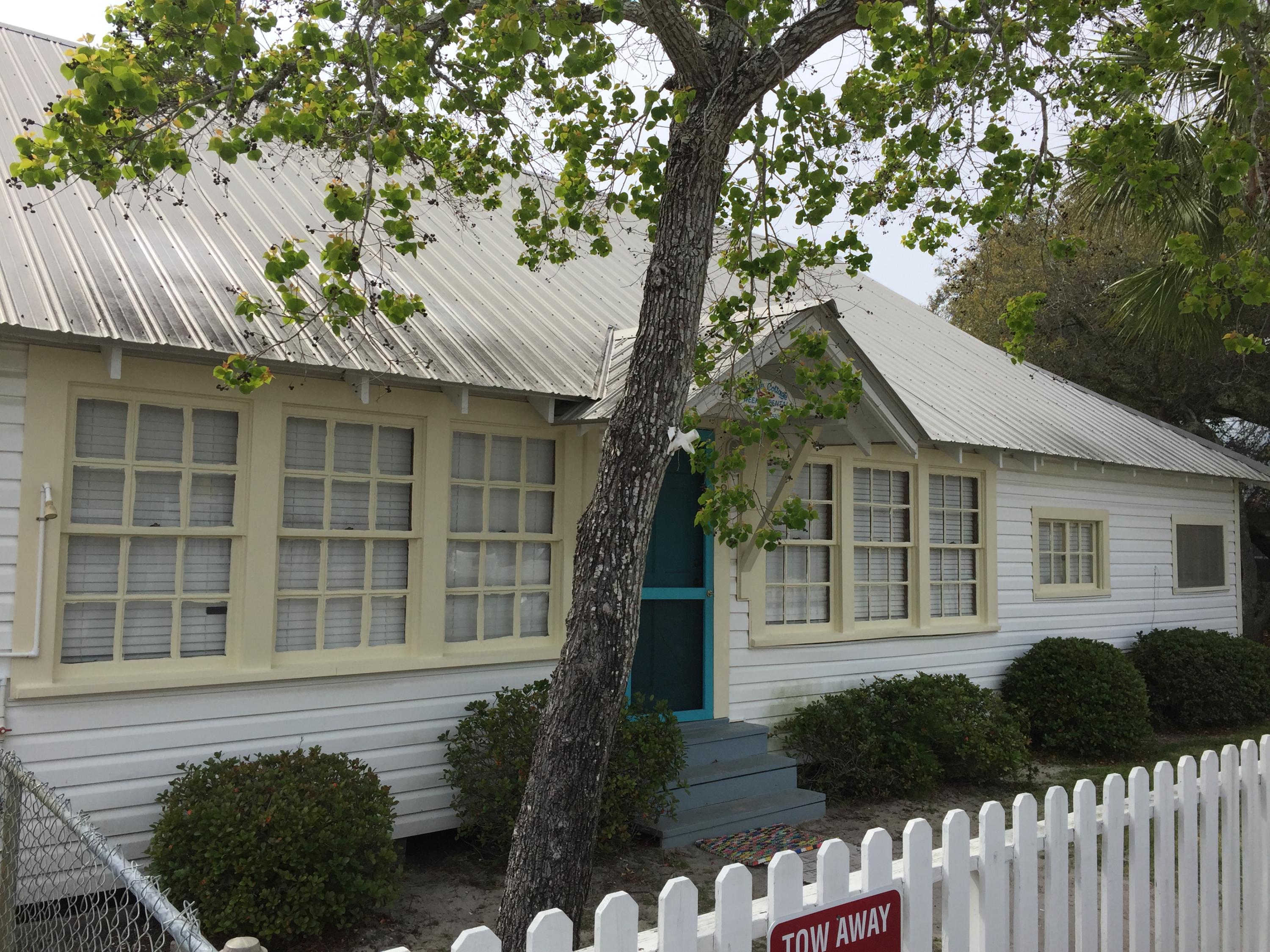 182 Garfield Street Santa Rosa Beach, FL 32459 - Photo 5 of 24 a front view of a house with a garden