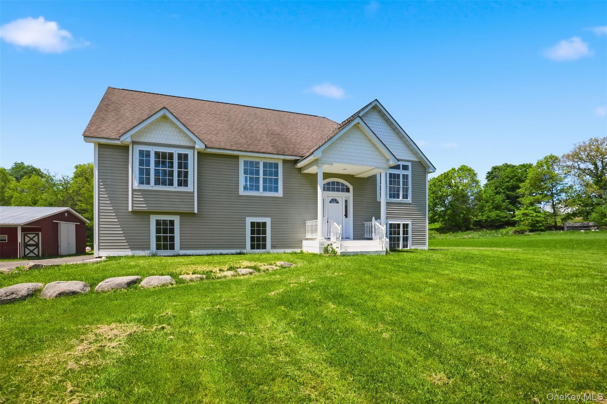 160 Pirog Road Pine Bush, NY 12566 - Photo 4 of 50 a front view of a house with a yard