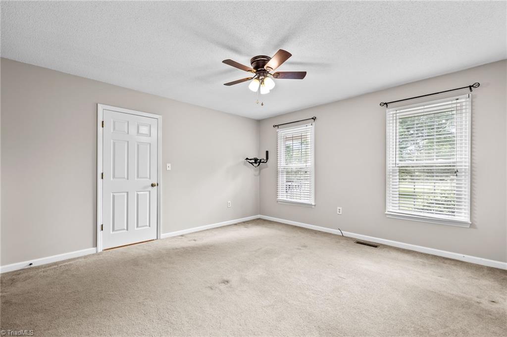 3603 Fieldview Road Pleasant Garden, NC 27313 - Photo 15 of 31 Spacious Primary Bedroom has double windows.