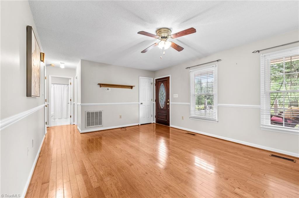 3603 Fieldview Road Pleasant Garden, NC 27313 - Photo 2 of 31 Welcoming living space, bathed in natural light and adorned with tasteful finishes.