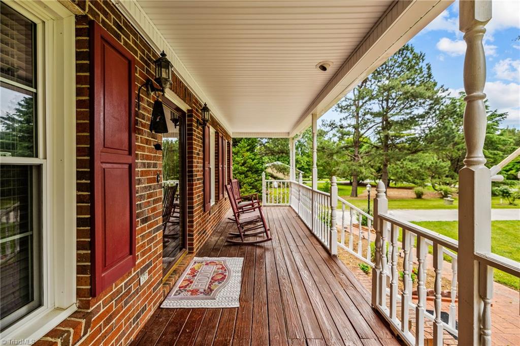 3603 Fieldview Road Pleasant Garden, NC 27313 - Photo 8 of 31 Rocking chair front porch
