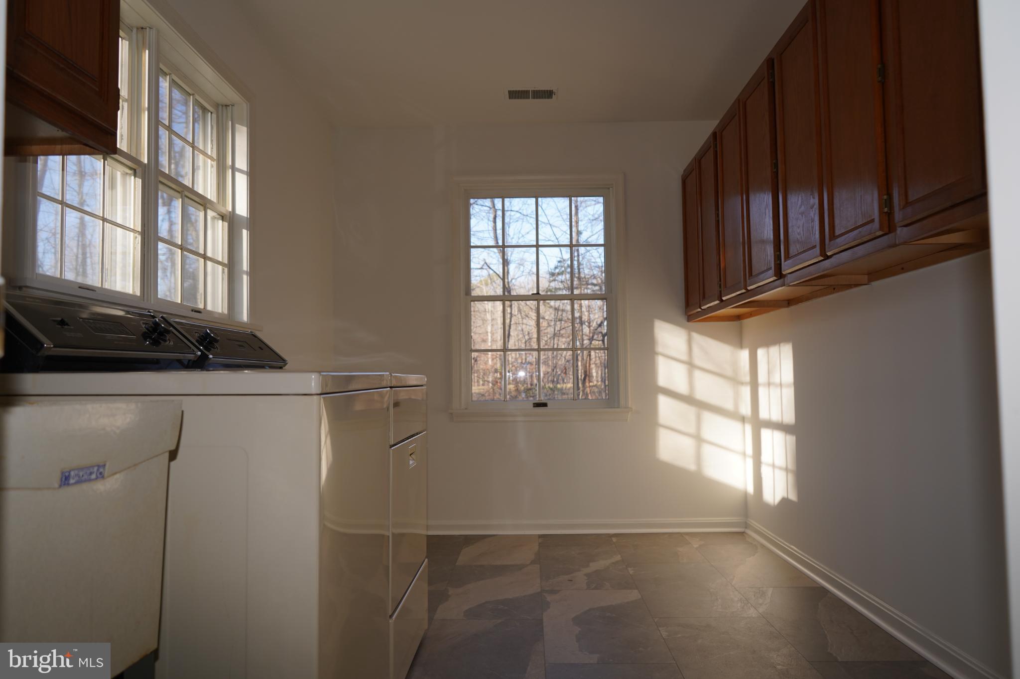 7323 O'Keefe Road Bealeton, VA 22712 - Photo 15 of 26 Bright and airy laundry space with sunlight.