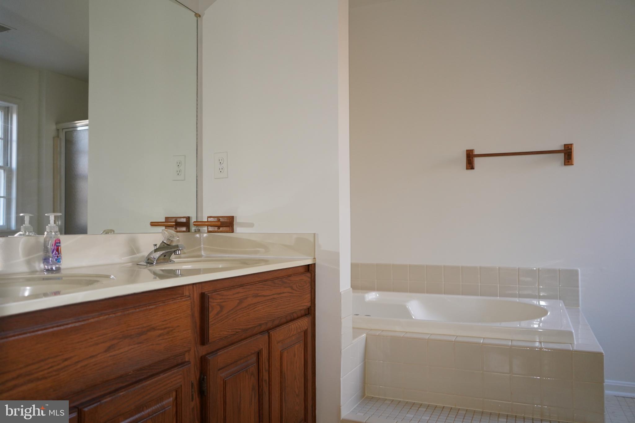 7323 O'Keefe Road Bealeton, VA 22712 - Photo 24 of 26 Serene bathroom with elegant fixtures.