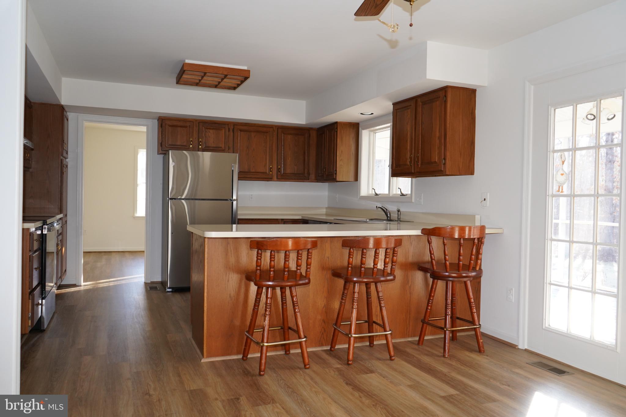 7323 O'Keefe Road Bealeton, VA 22712 - Photo 9 of 26 Inviting kitchen with warm wood accents.