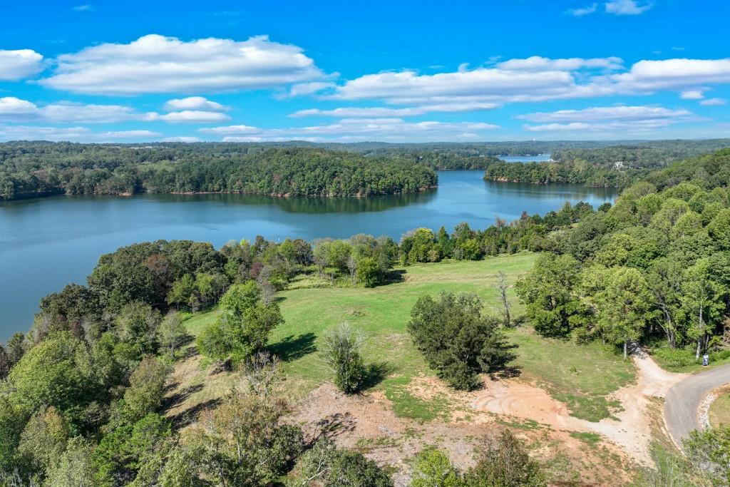4596 Shirley Road Gainesville, GA 30506 - Photo 10 of 22 a view of a lake with houses in the back