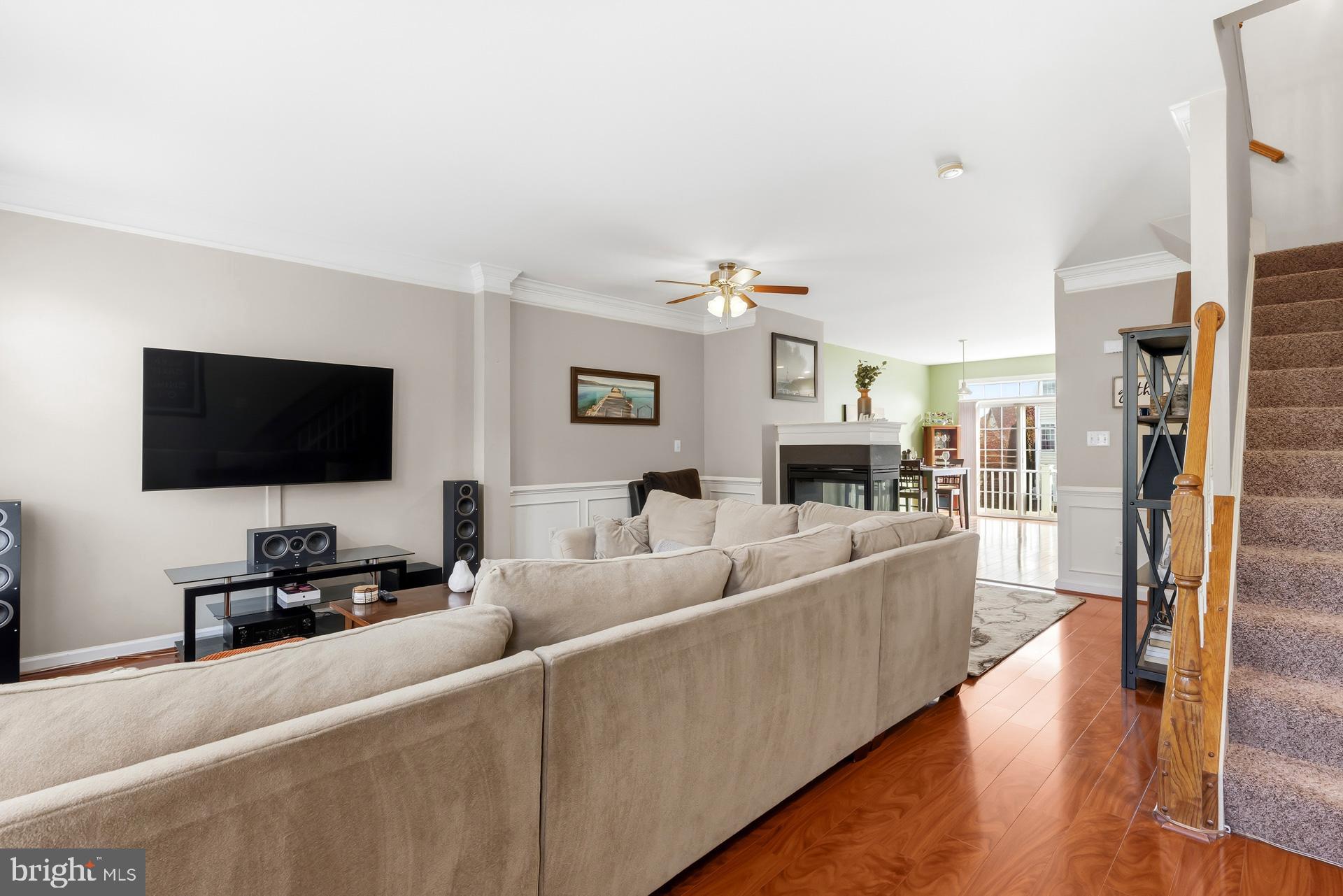 10423 Rifle Road Bristow, VA 20136 - Photo 12 of 39 a living room with furniture and a flat screen tv