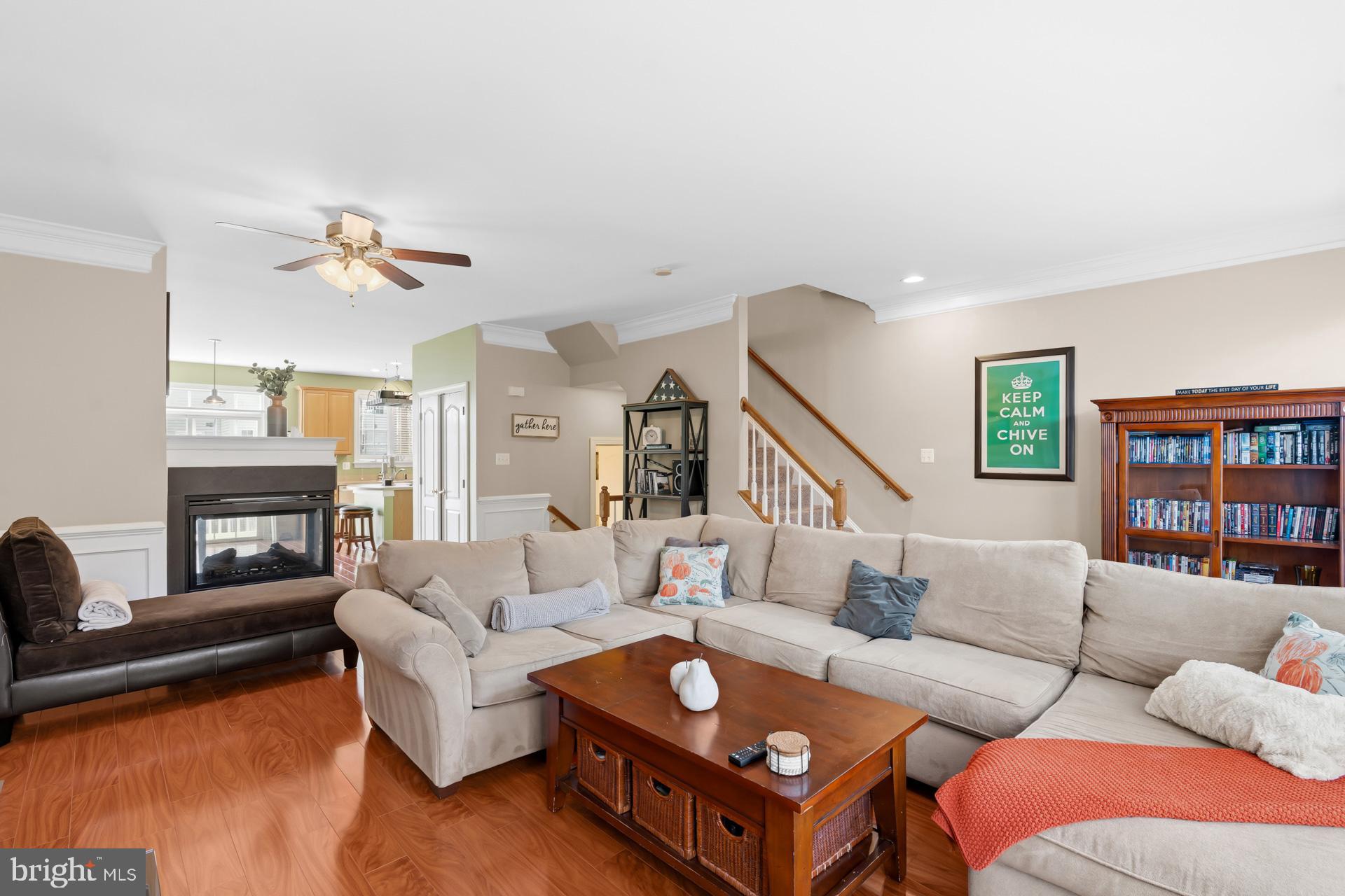 10423 Rifle Road Bristow, VA 20136 - Photo 16 of 39 a living room with furniture and a fireplace